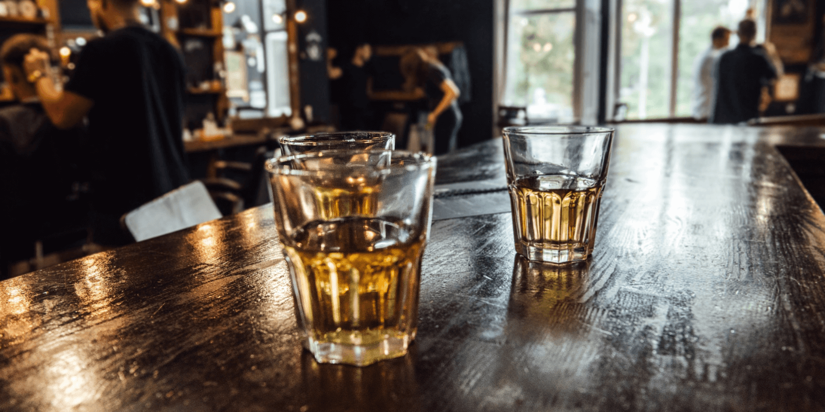 Whiskey glass on bar top