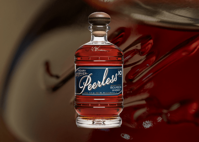 Peerless Henry Kraver's Old Reserve 10 Year Kentucky Straight Bourbon Whiskey Batch 1 bottle at 117.6 proof against a blurred close-up bottle view background